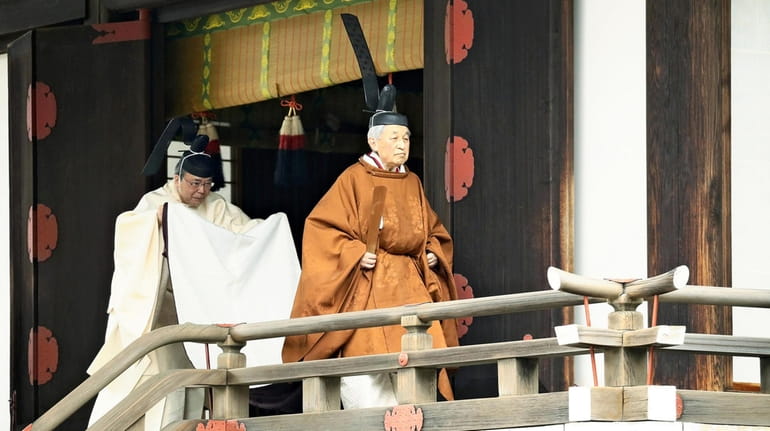 The Emperor of Japan leaves the Kashikodokoro shrine at the...