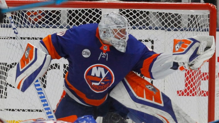 Islanders goaltender Robin Lehner make the glove save during the third...