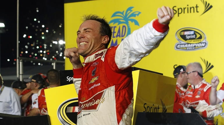 FILE - Kevin Harvick celebrates after winning the NASCAR Sprint...