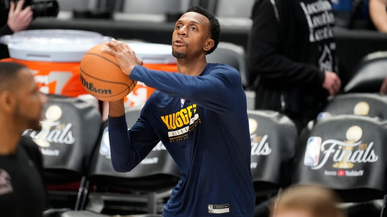 Denver Nuggets guard Ish Smith shoots the ball during practice...