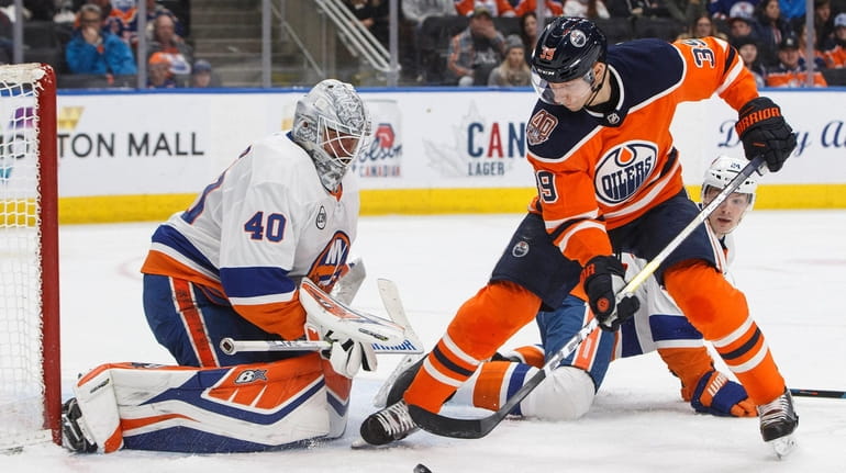 Islanders goalie Robin Lehner makes a save against Edmonton Oilers'...