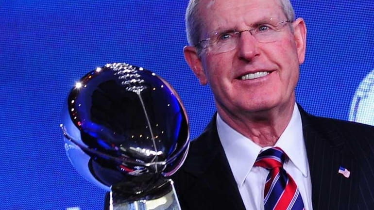 New York Giants head coach Tom Coughlin poses with the...