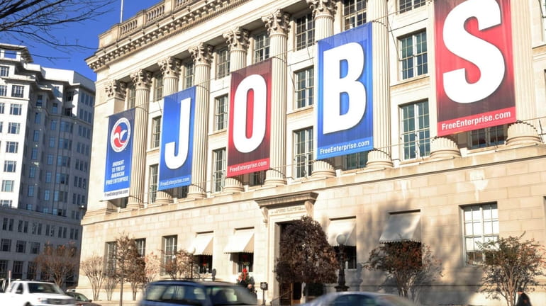 A jobs sign hangs above the entrance to the U.S....