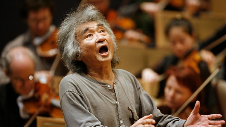 Former director of the Boston Symphony Orchestra Seiji Ozawa conducts...