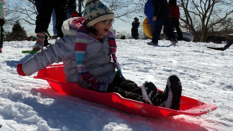 Adrianna Danielo sets off on a sled ride in Cedar...