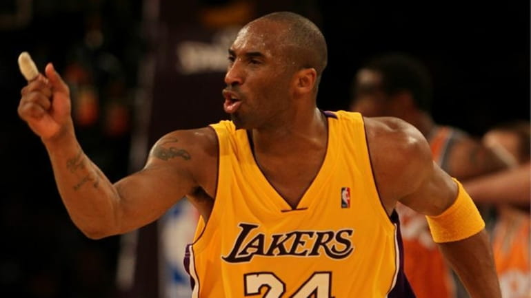 Kobe Bryant #24 of the Los Angeles Lakers reacts to...