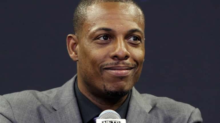 Paul Pierce talks to reporters at his introductory press conference...