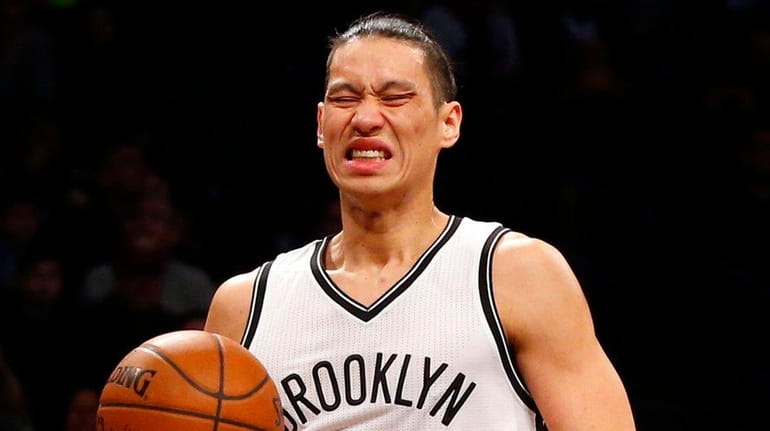 Jeremy Lin #7 of the Brooklyn Nets reacts during the...