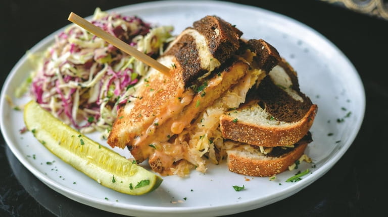 The vegan Reuben sandwich, made with marinated and grilled tempeh...