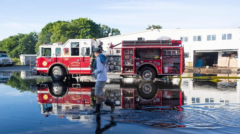 Firefighters at Braun Seafood Co. in Cutchogue on Wednesday morning.