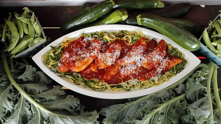 Valarella's spiralized zucchini pasta with poached chicken tenders and red...