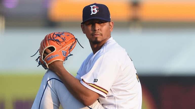 Carlos Carrasco of the Brooklyn Cyclones delivers to the plate...