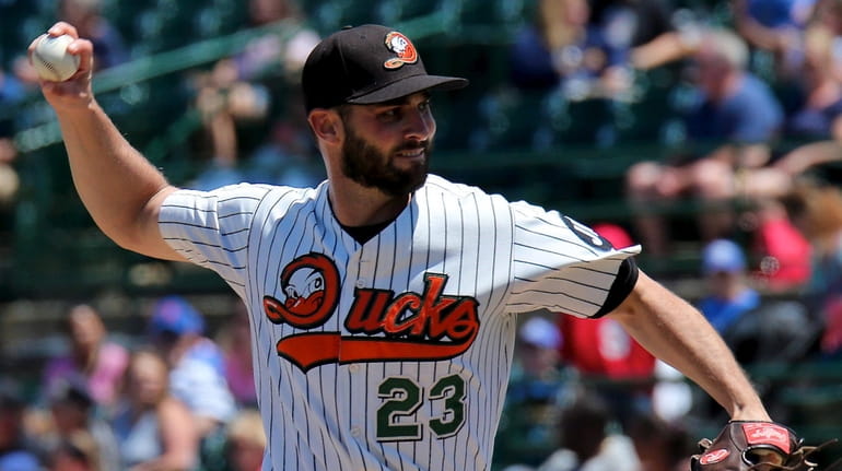 Long Island Ducks starting pitcher Travis Banwart delivers a pitch...