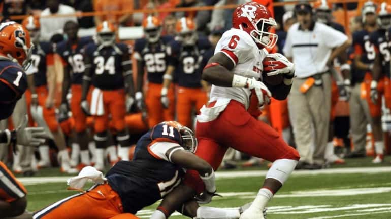 Rutgers' Mohamed Sanu breaks away from Syracuse's Marquis Spruill during...