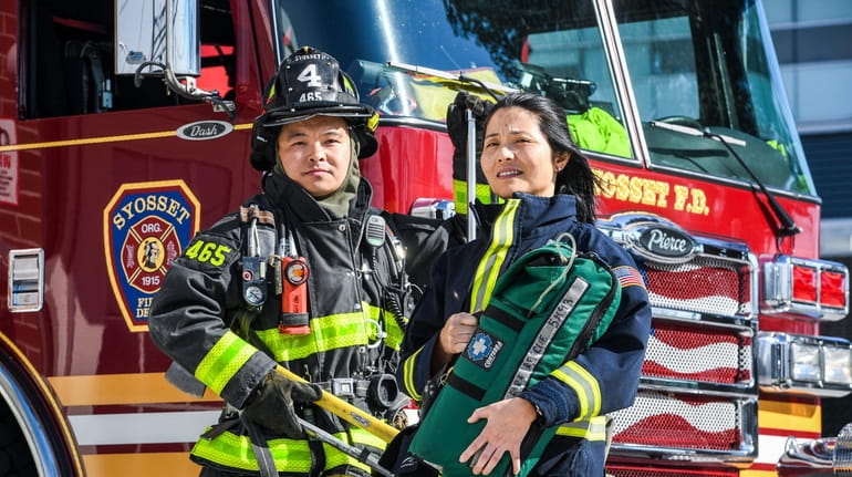 Volunteer firefighter Bo Tian and volunteer emergency medical technician Hai...