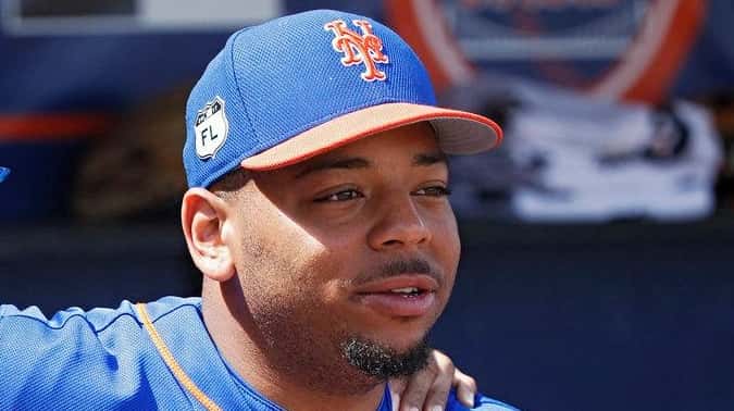 Dominic Smith #74 of the New York Mets talks with...