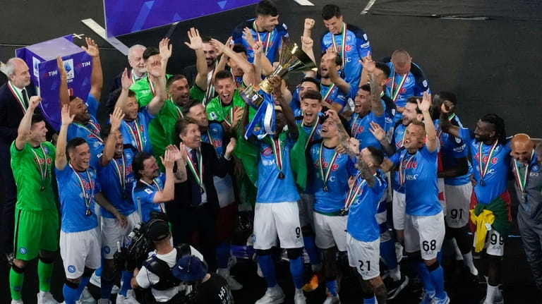 Napoli's players celebrate after winning the Serie A soccer title...
