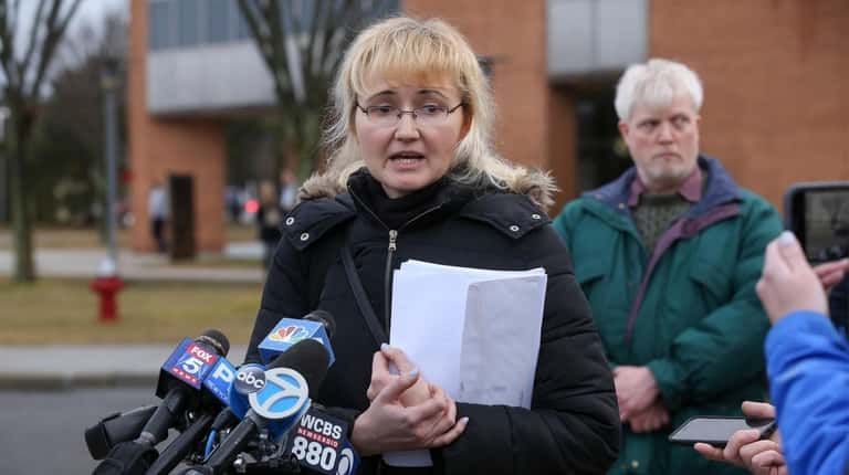 Justyna Zubko-Valva speaks to reporters outside Suffolk County Family Court in...