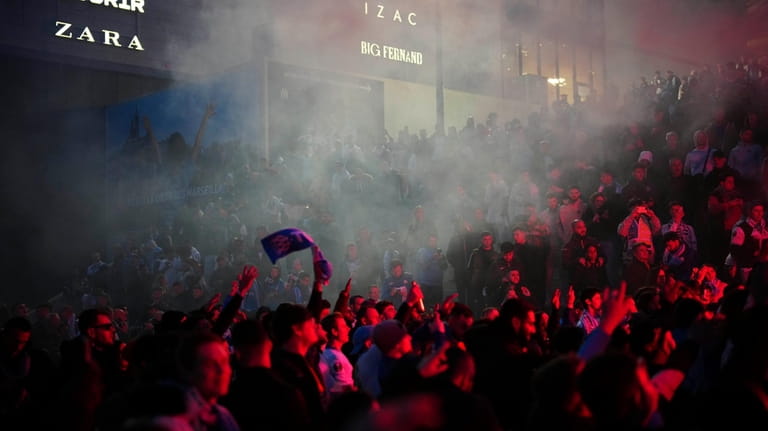 Fans of Marseille cheers for their team prior to the...