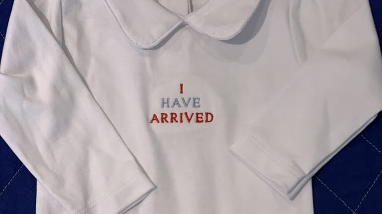 This "I have arrived" white cotton onesie ($55) is a...