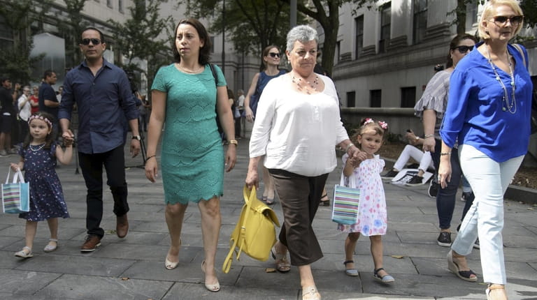 Pablo Villavicencio's wife, Sandra Chica, in green dress, arrives at...