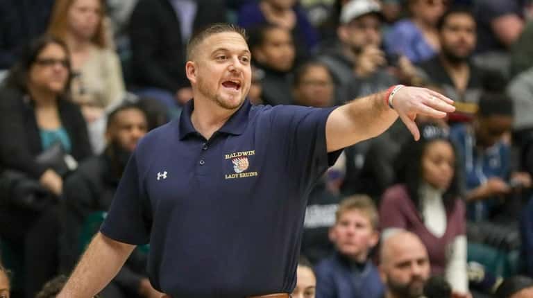 Head Coach Tom Catapano of Baldwin directs his defense during...