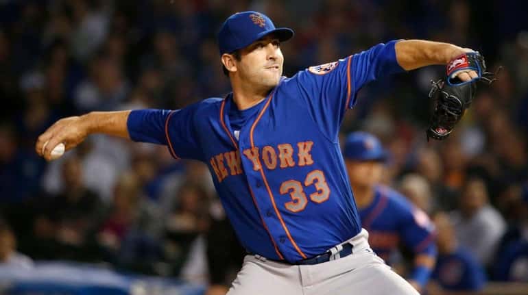 Mets starting pitcher Matt Harvey delivers against the Cubs on...