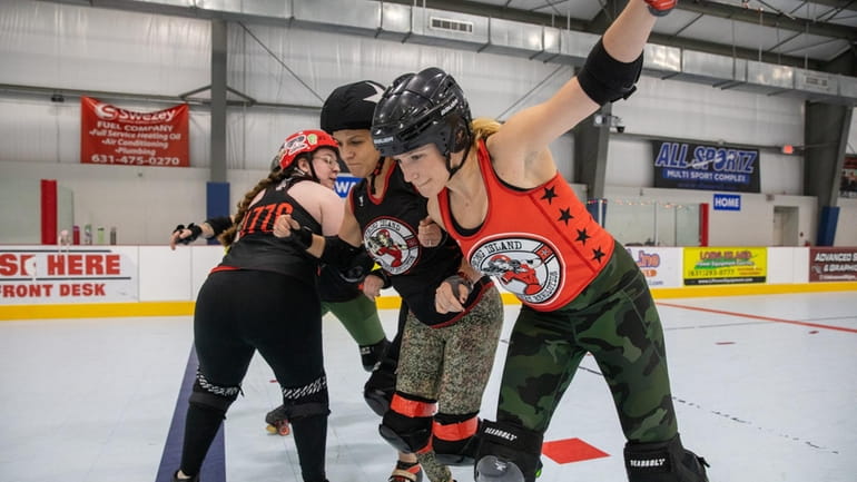 Skaters scrimmage during a Strong Island Roller Derby practice at...