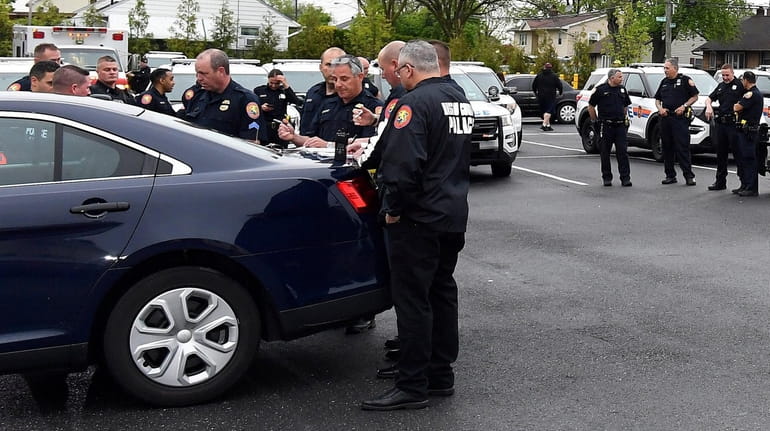Hicksville fire department members and Nassau police gather search for...