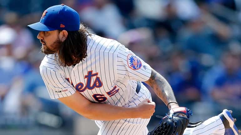 Mets starter Robert Gsellman delivers against the Nationals at Citi Field...