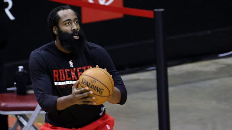 James Harden #13 of the Houston Rockets warms up prior...