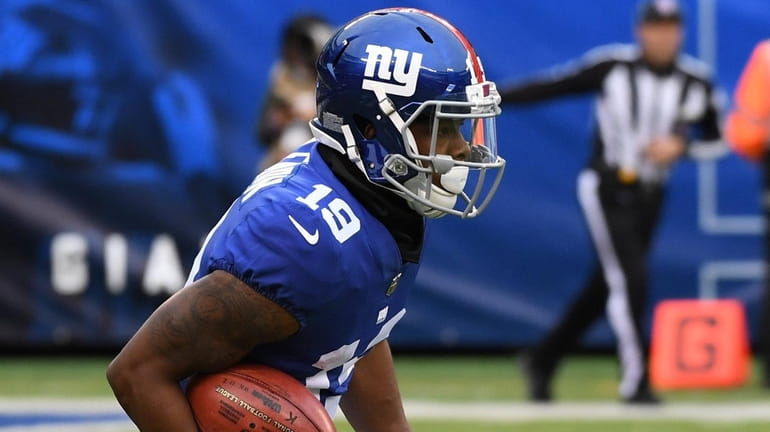 Giants wide receiver Corey Coleman runs the ball against the...
