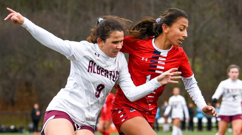 MacArthur's Ysabelle Perillo, right, keeps the ball from Albertus Magnus'...