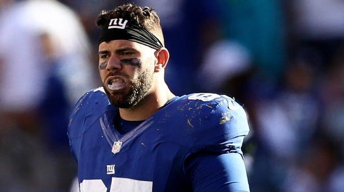 Justin Pugh of the New York Giants reacts to the...
