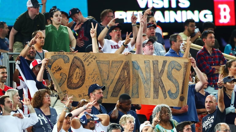 Fans show their support during the MLB London Series game...