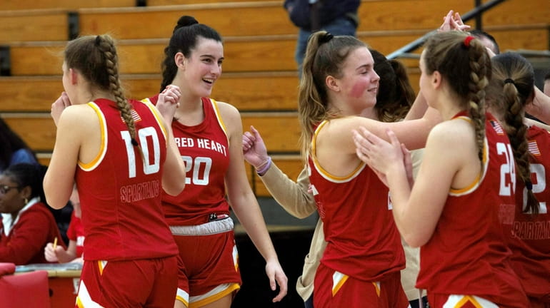 Sacred Heart players celebrate after defeating Fontbonne Hall in a CHSAA...