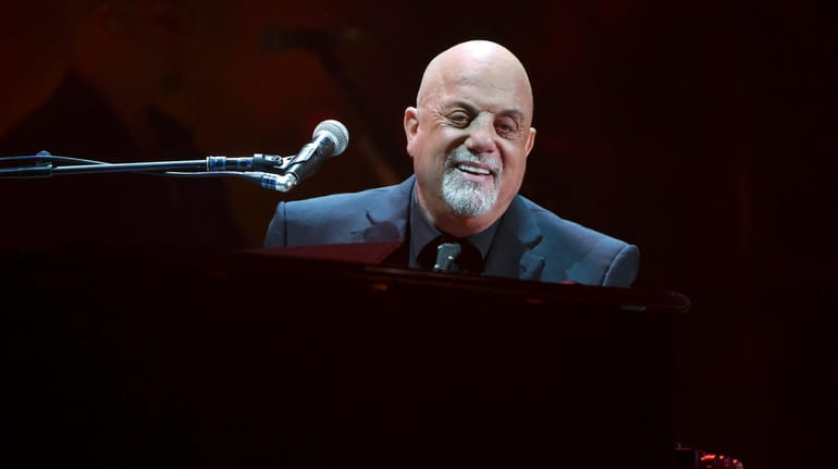 Billy Joel performs during his 100th Madison Square Garden concert...