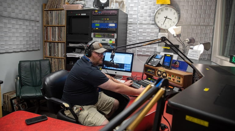 Stony Brook University campus radio DJ Scott O'Rourke runs an...
