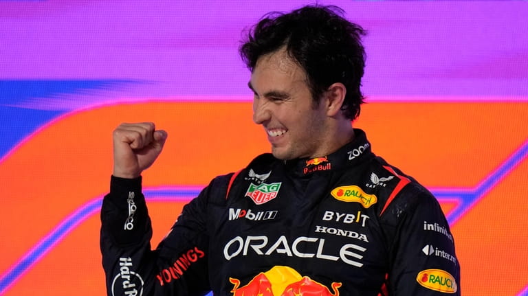 Red Bull driver Sergio Perez of Mexico celebrates after he...