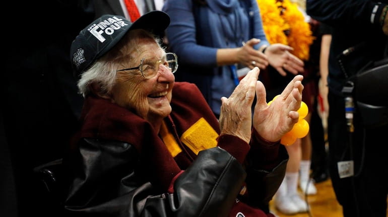 Sister Jean Dolores Schmidt celebrates with the Loyola-Chicago Ramblers after...