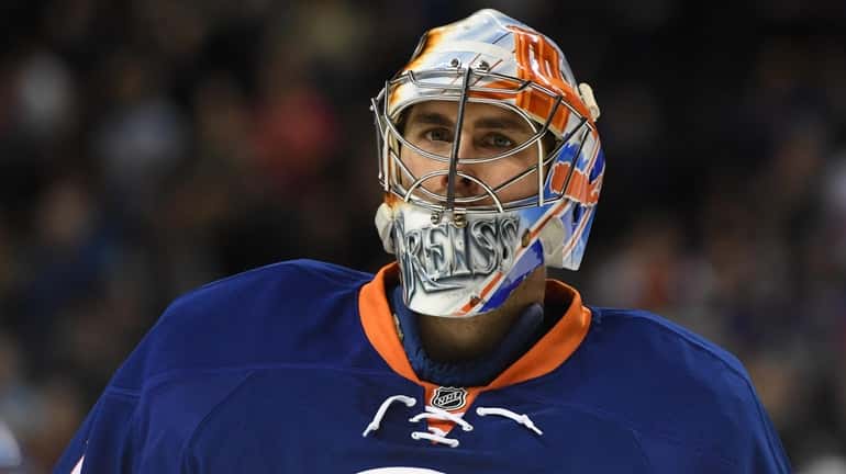 New York Islanders goalie Thomas Greiss looks on during a...