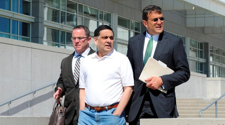Harendra Singh walks out of federal court in Central Islip...