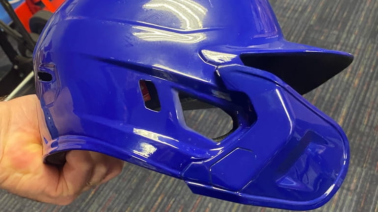 A Mets protective batting helmet with a face shield extension. 