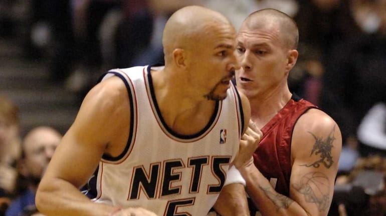 Nets' Jason Kidd dealing on Jason Williams of the Heat...