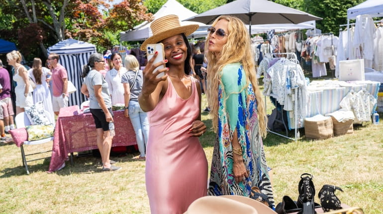 Fashion designer Rachel Zoe poses with vendor Linda Ruvarasheat at the...