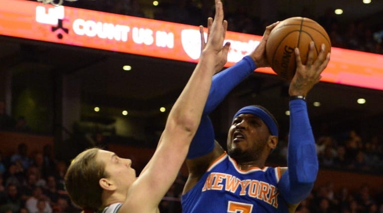 Knicks' Carmelo Anthony shoots over Boston Celtics' Kelly Olynyk during...
