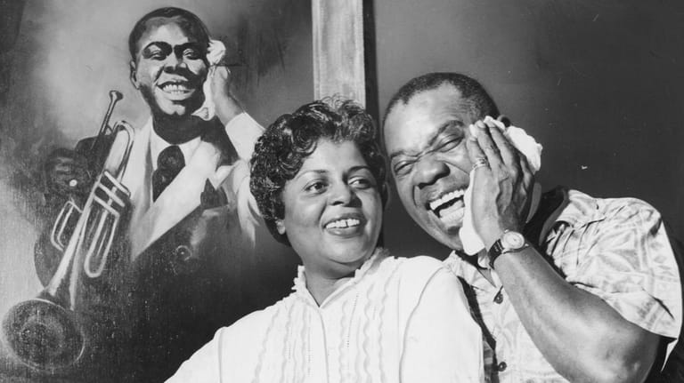 Louis Armstrong and his wife, Lucille, at their home on 107th...