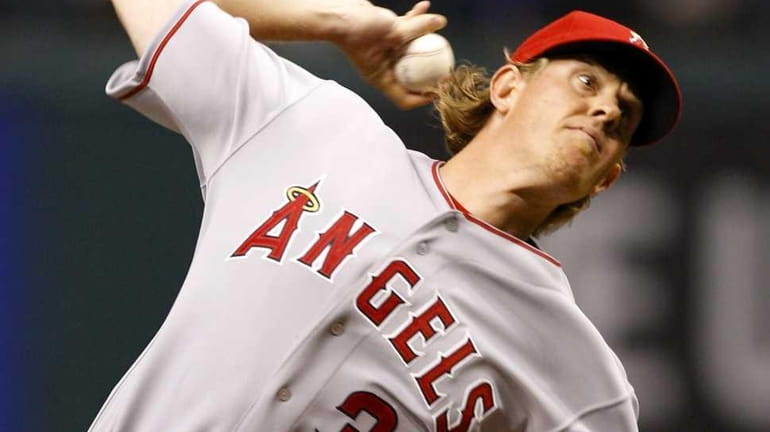 Los Angeles Angels starting pitcher Jered Weaver throws in the...