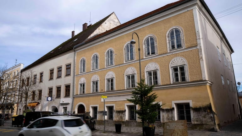A car passes Adolf Hitler's birth house in Braunau, Austria,...