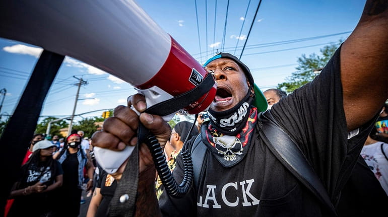 Demonstrators take to the streets in Roosevelt, calling for justice in...
